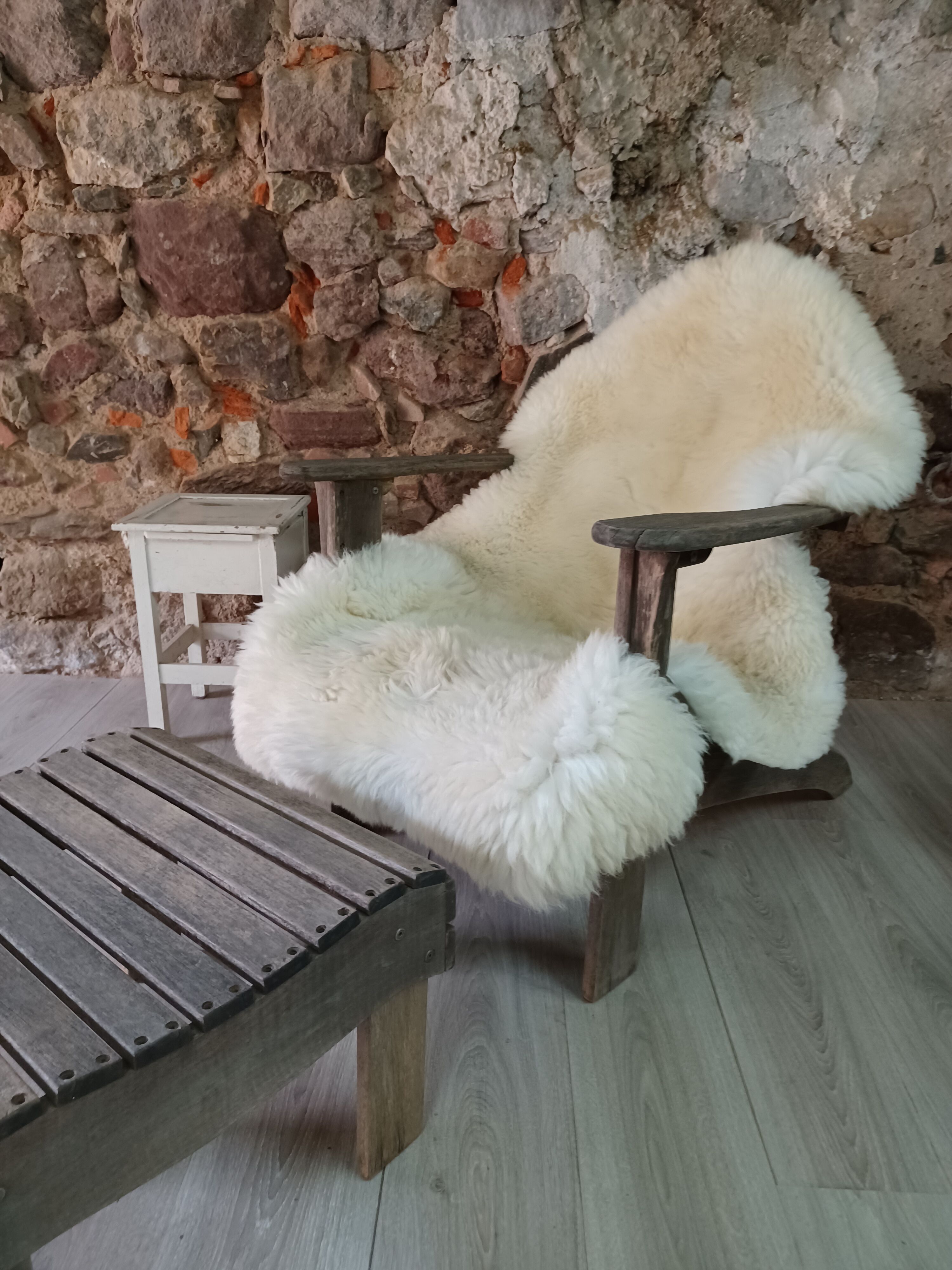 Ancient Adirondack armchair with footrest