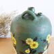 Cruche ancienne en terre cuite peinte en vert