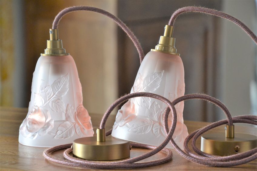 Pair of art nouveau style pendants in pink molded glass