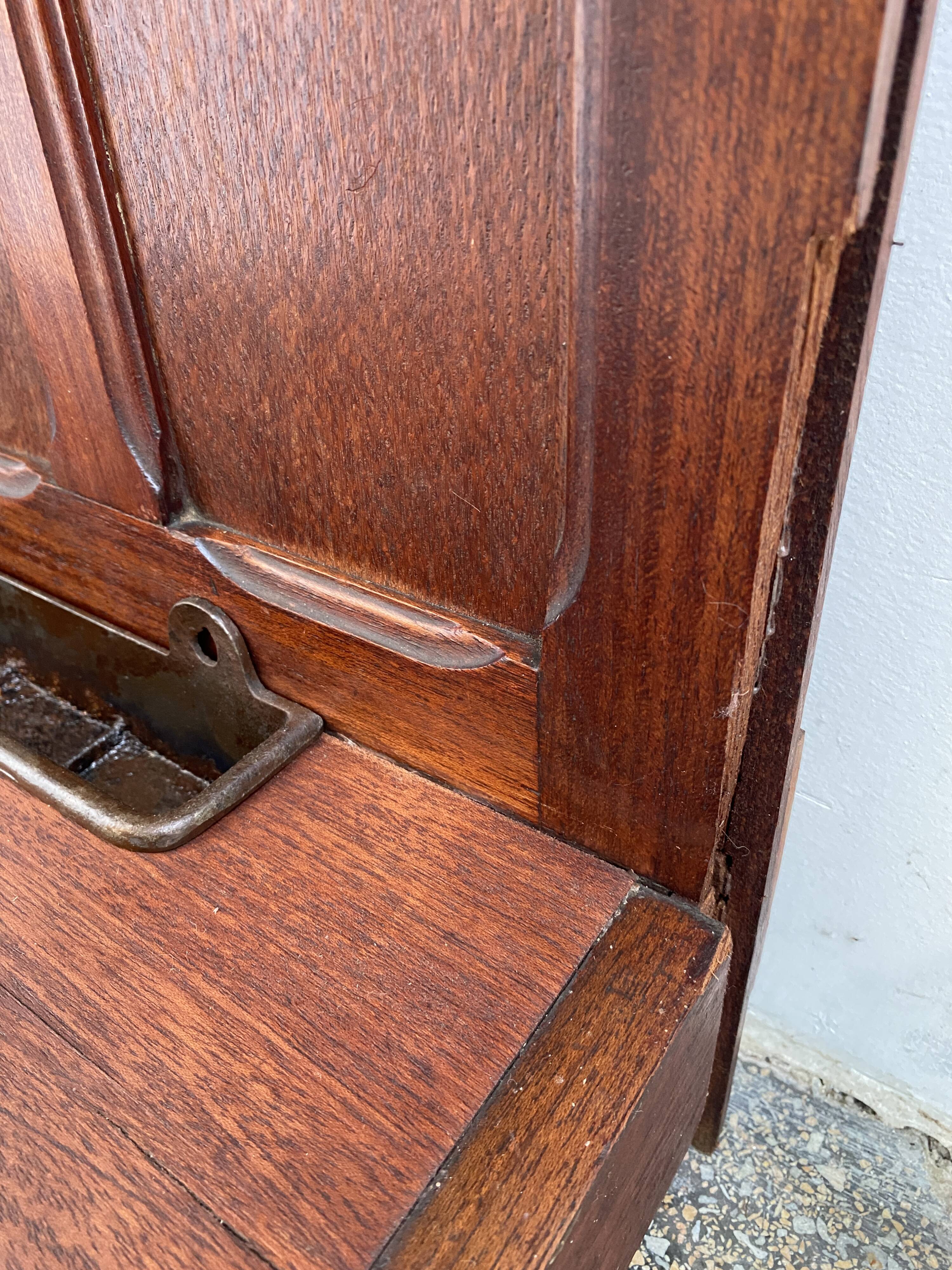 Antique wooden coat rack with mirror and shelf.