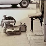 Photo of New York, Cat with rolling eyes in front of a shoe shine, 1960