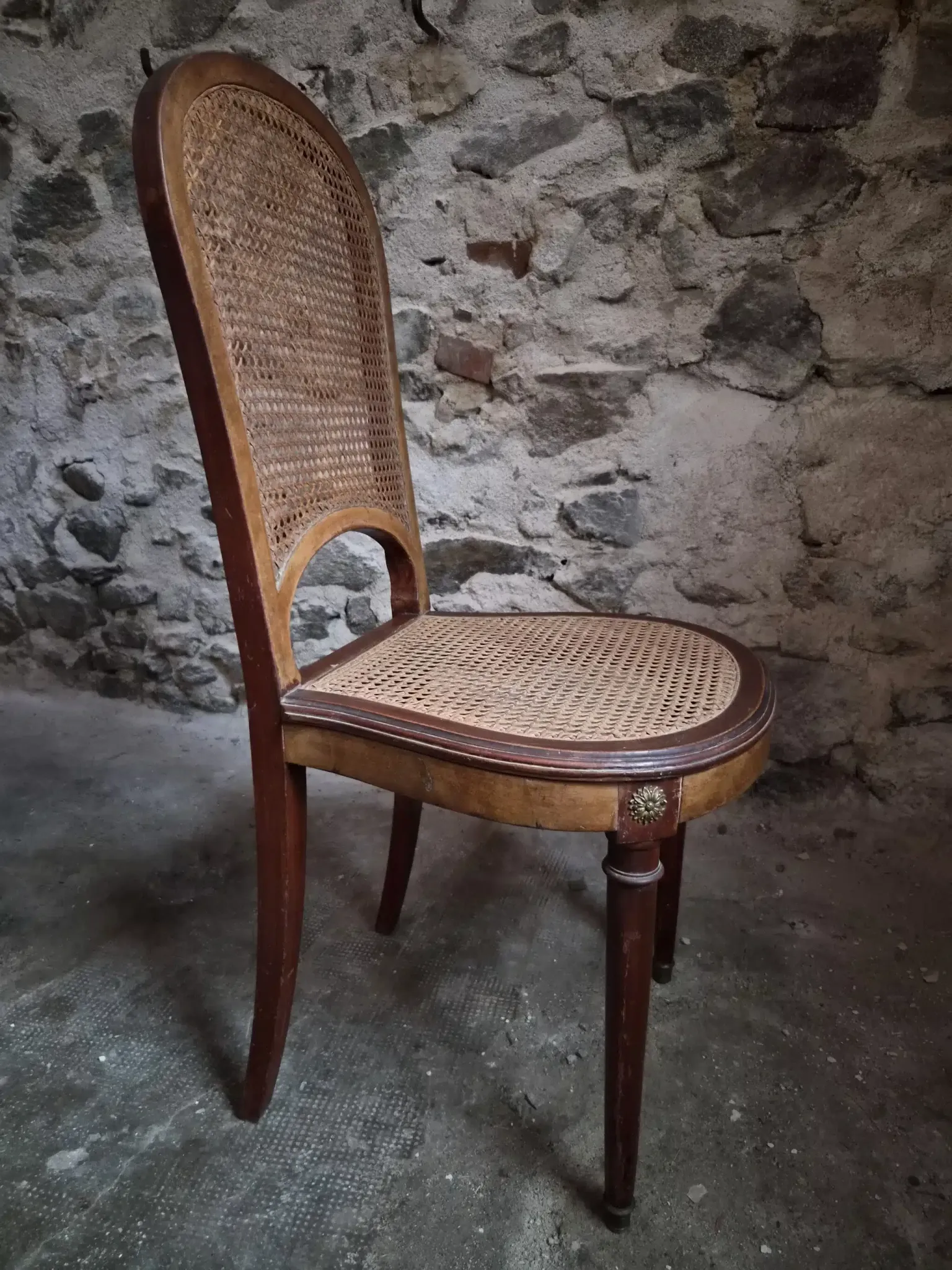 Set of 6 antique Louis XVI style dining chairs with caning.