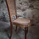 Set of 6 antique Louis XVI style dining chairs with caning.