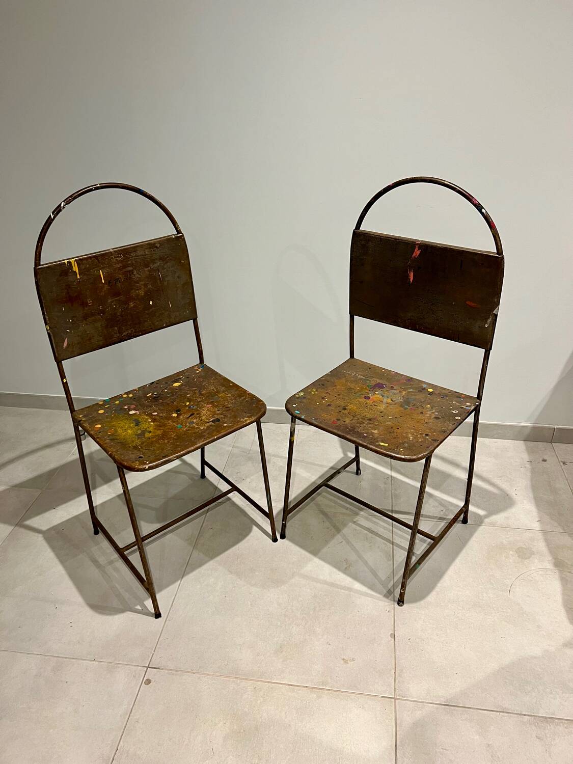 Pair of vintage raw metal chairs