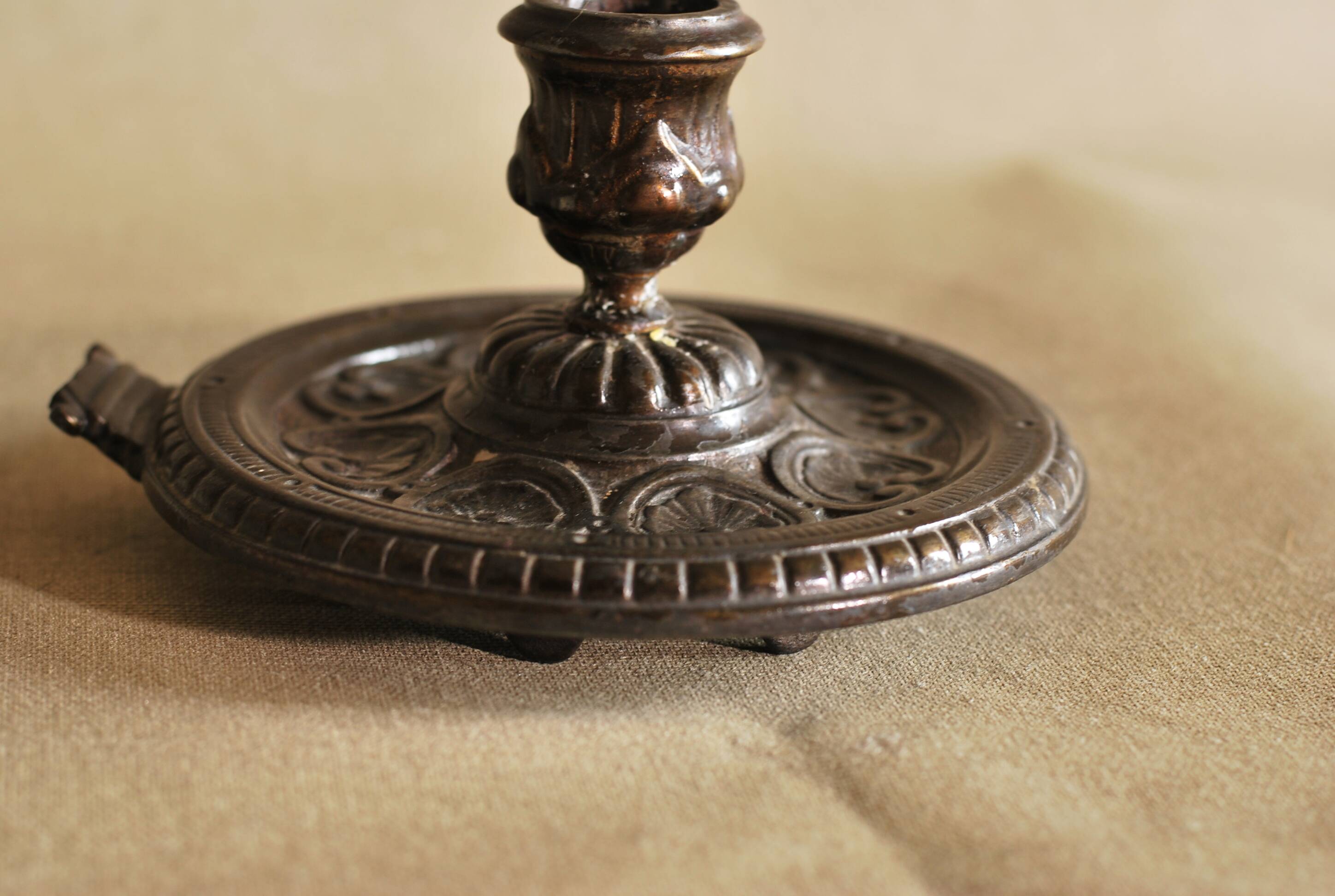 Bronze cellar rat hand candle holder
