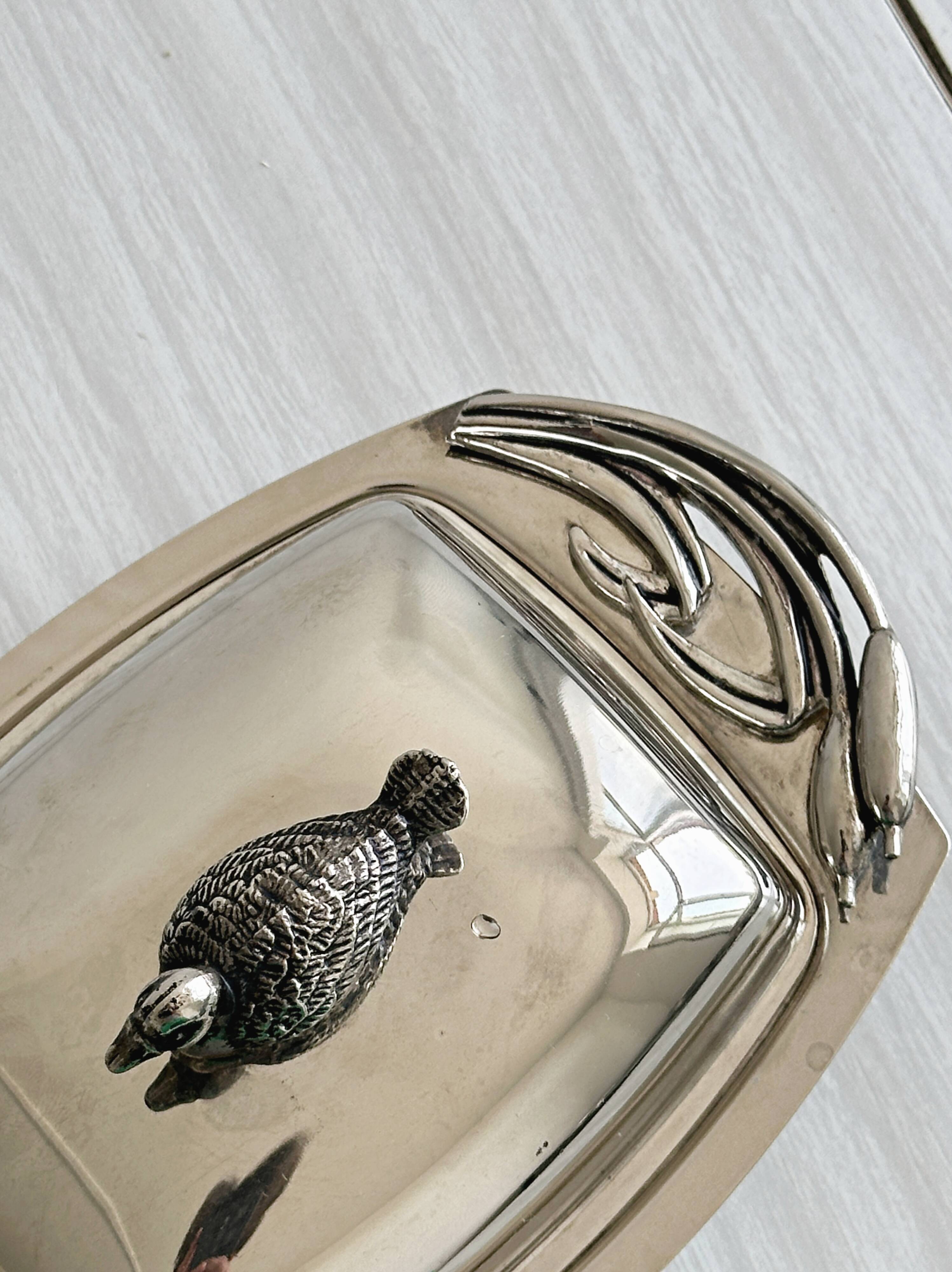 Antique shiny metal butter dish