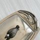 Antique shiny metal butter dish