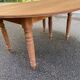 Round extendable banquet table stripped in solid mahogany with 4 extensions, 19th century.
