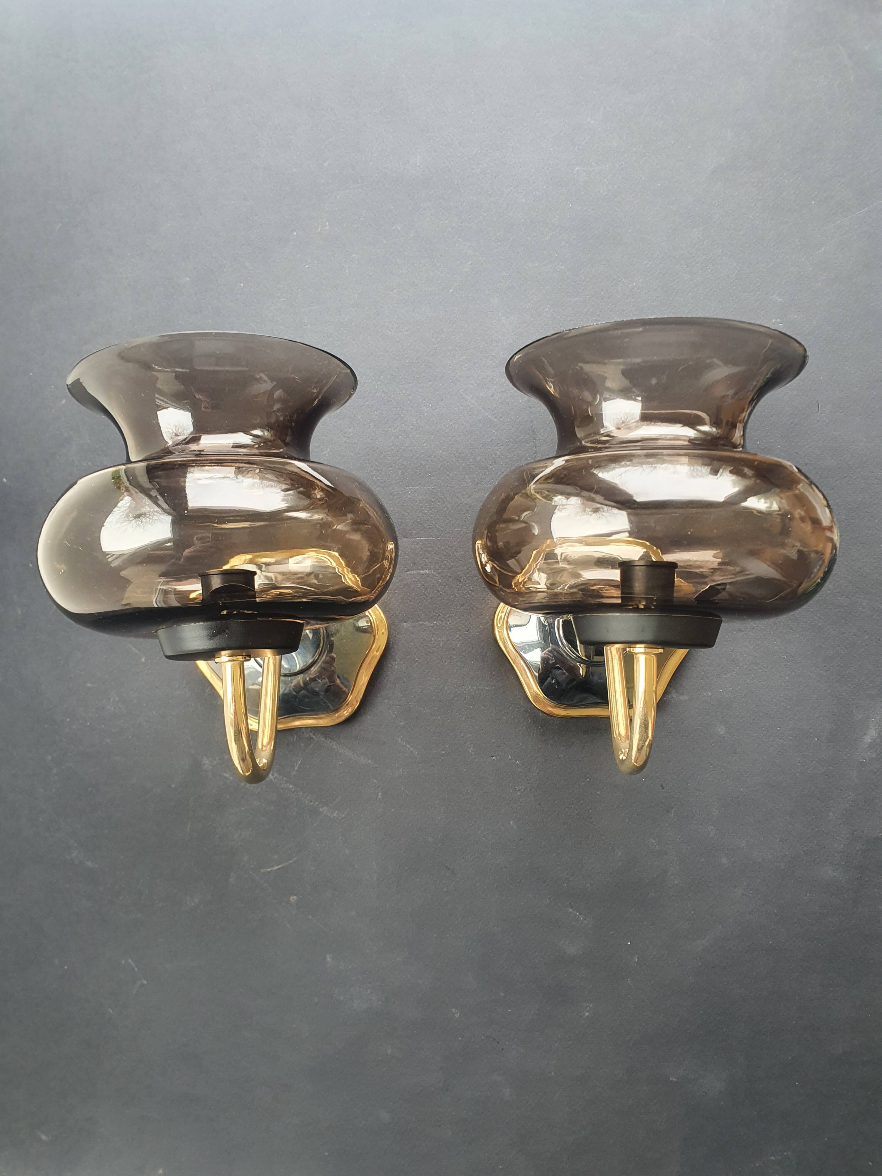 Pair of antique gold-plated brass and smoked glass wall lights.