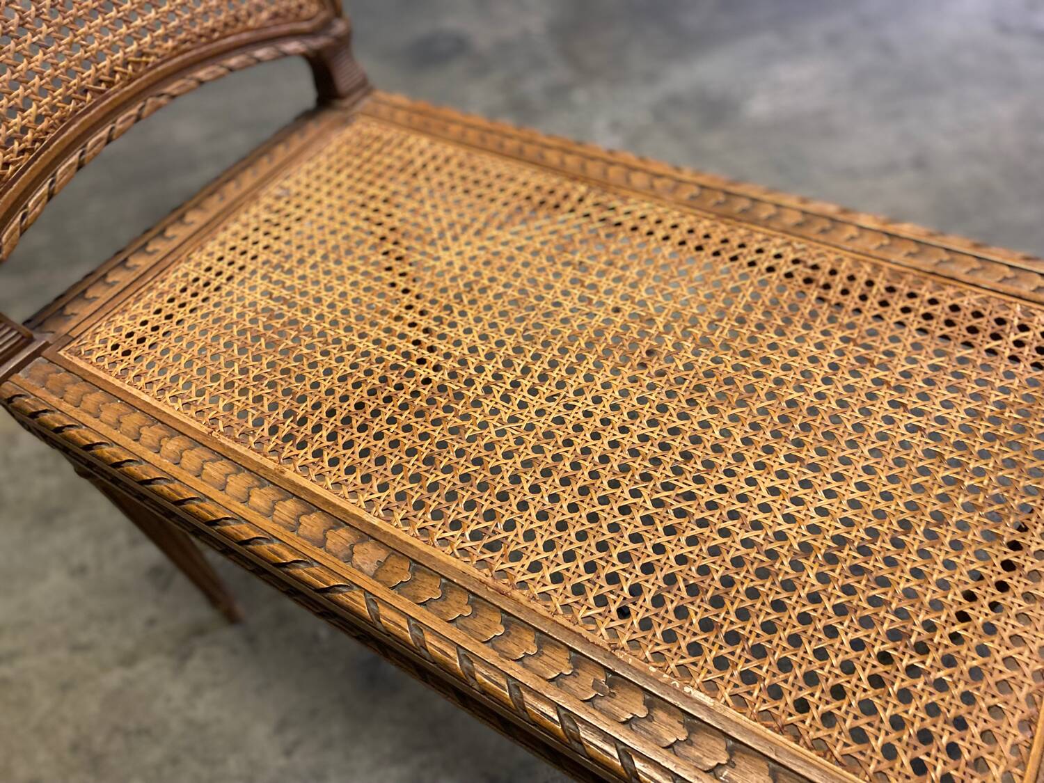 Wooden and cane bench (piano bench)