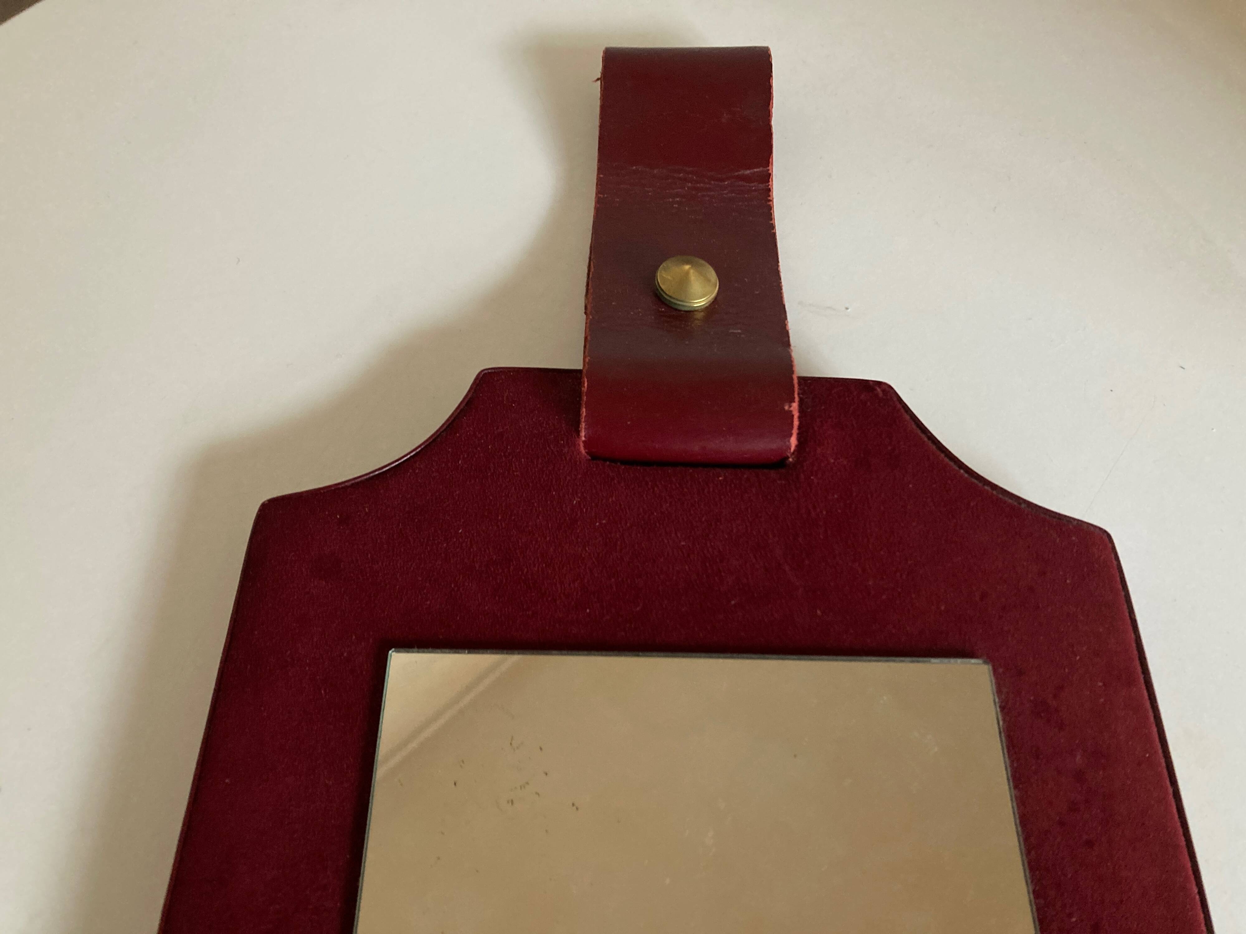 1960 cloakroom mirror with leather and brass shelf