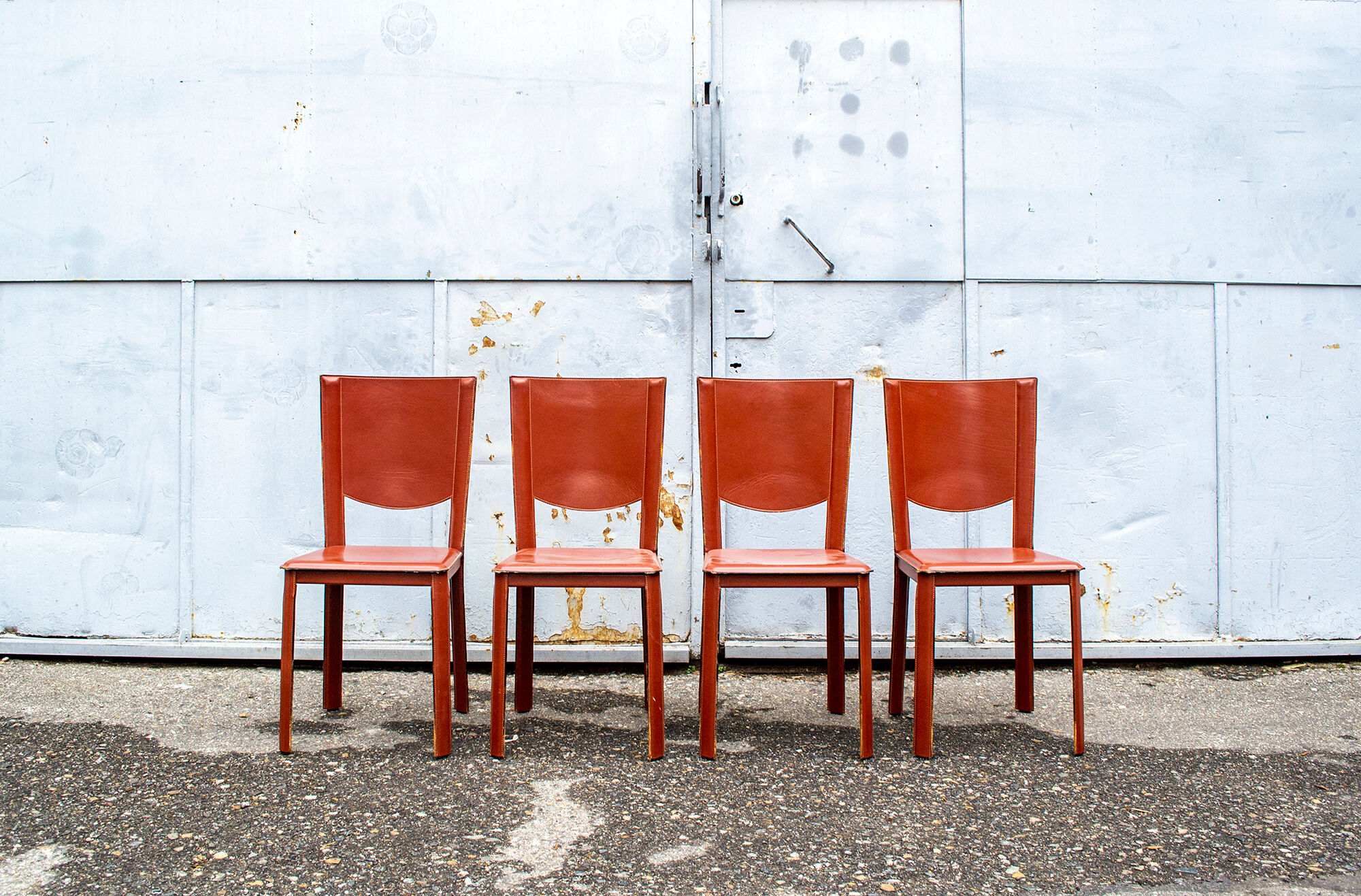 Set of four leather chairs by Enrico Pellizzoni 70s