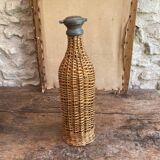Woven wicker bottle