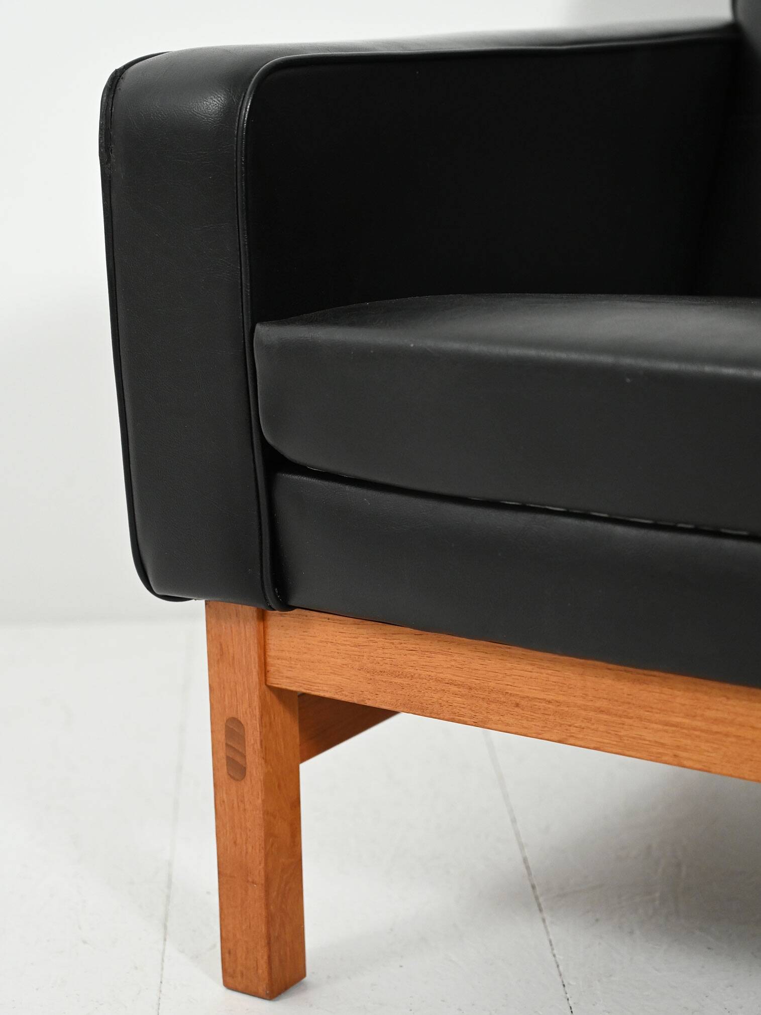 Swedish AB Futura teak and faux leather armchair