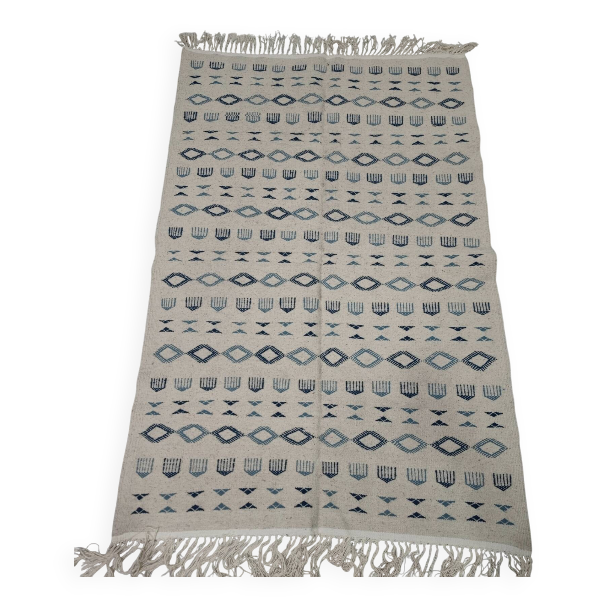 Handmade white and blue rug made of natural wool