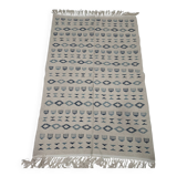Handmade white and blue rug made of natural wool