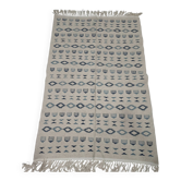 Handmade white and blue rug made of natural wool