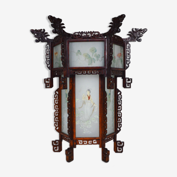 Asian wooden lantern carved with dragons and painted glass panels