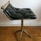 Pair of Chesterfield style brass and leather stools