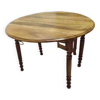 ﻿Round shutter table in solid walnut