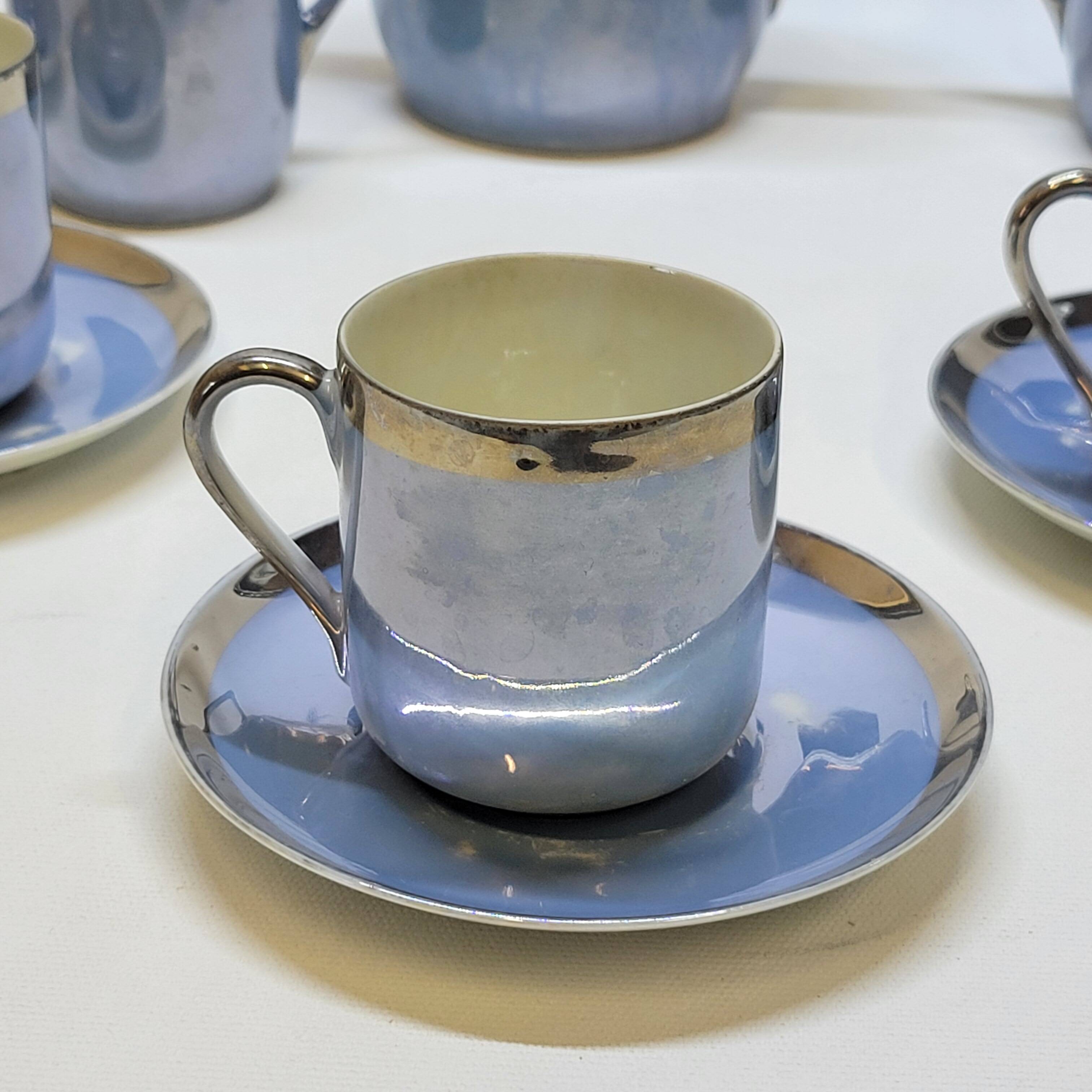 Art deco coffee service in fine iridescent blue porcelain, metal and wood
