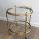 Round brass rolling table attributed to Maison Jansen