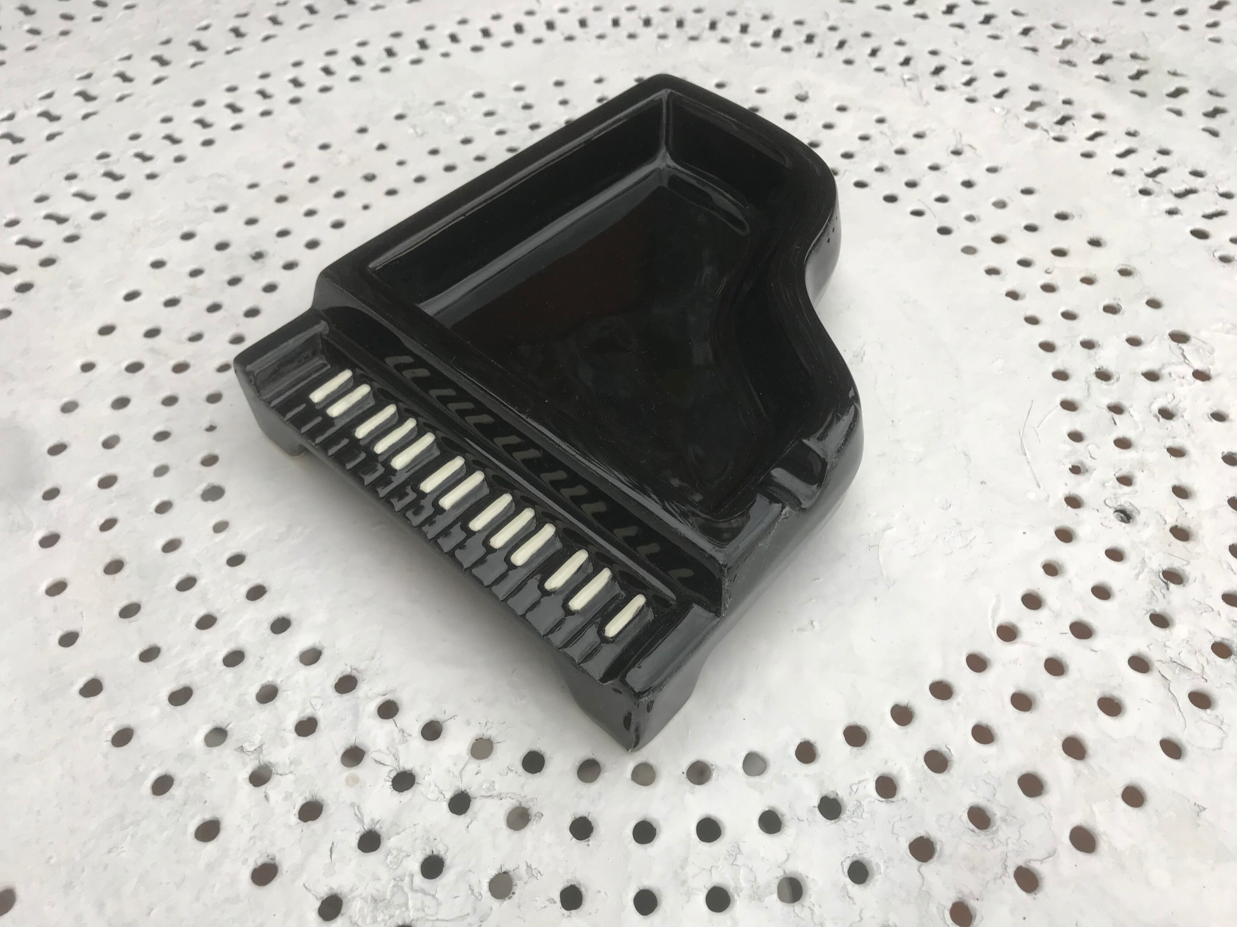 Old ceramic piano ashtray