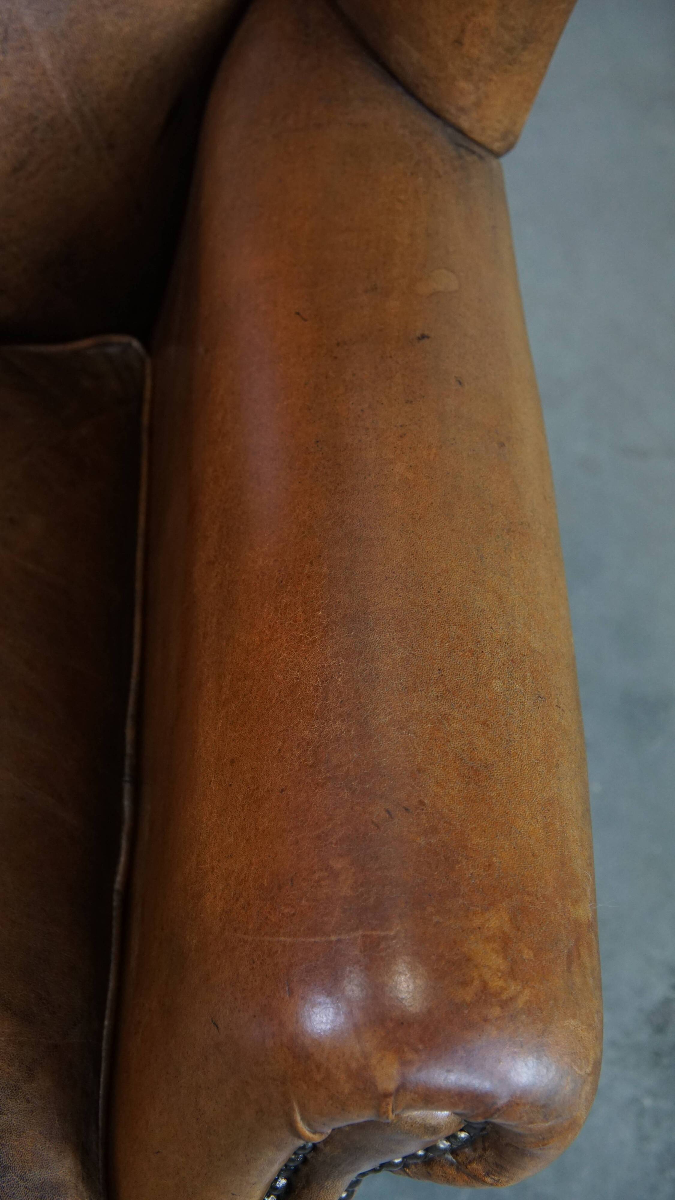Sheepskin wing chair + XXL patinated footrest