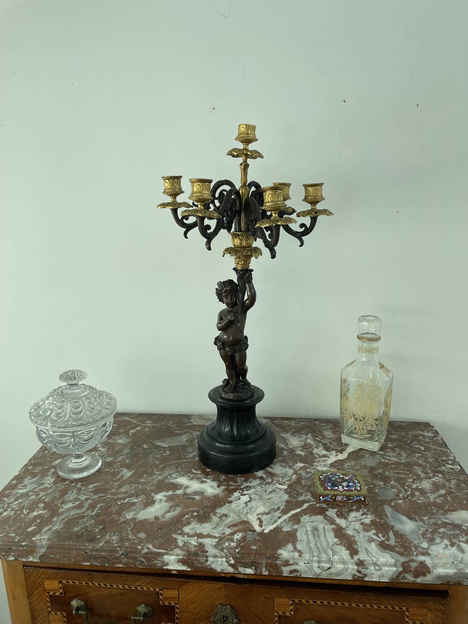 Candelabra with cherub in patinated bronze
