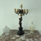 Candelabra with cherub in patinated bronze