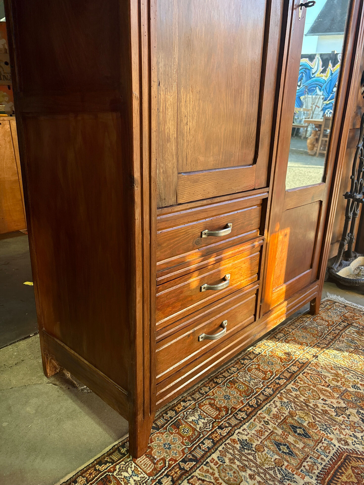 Antique Parisian wardrobe with mirror, hanging space and drawers.