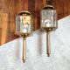 Brass and beveled glass lantern-like wall lamps in brass and beveled glass