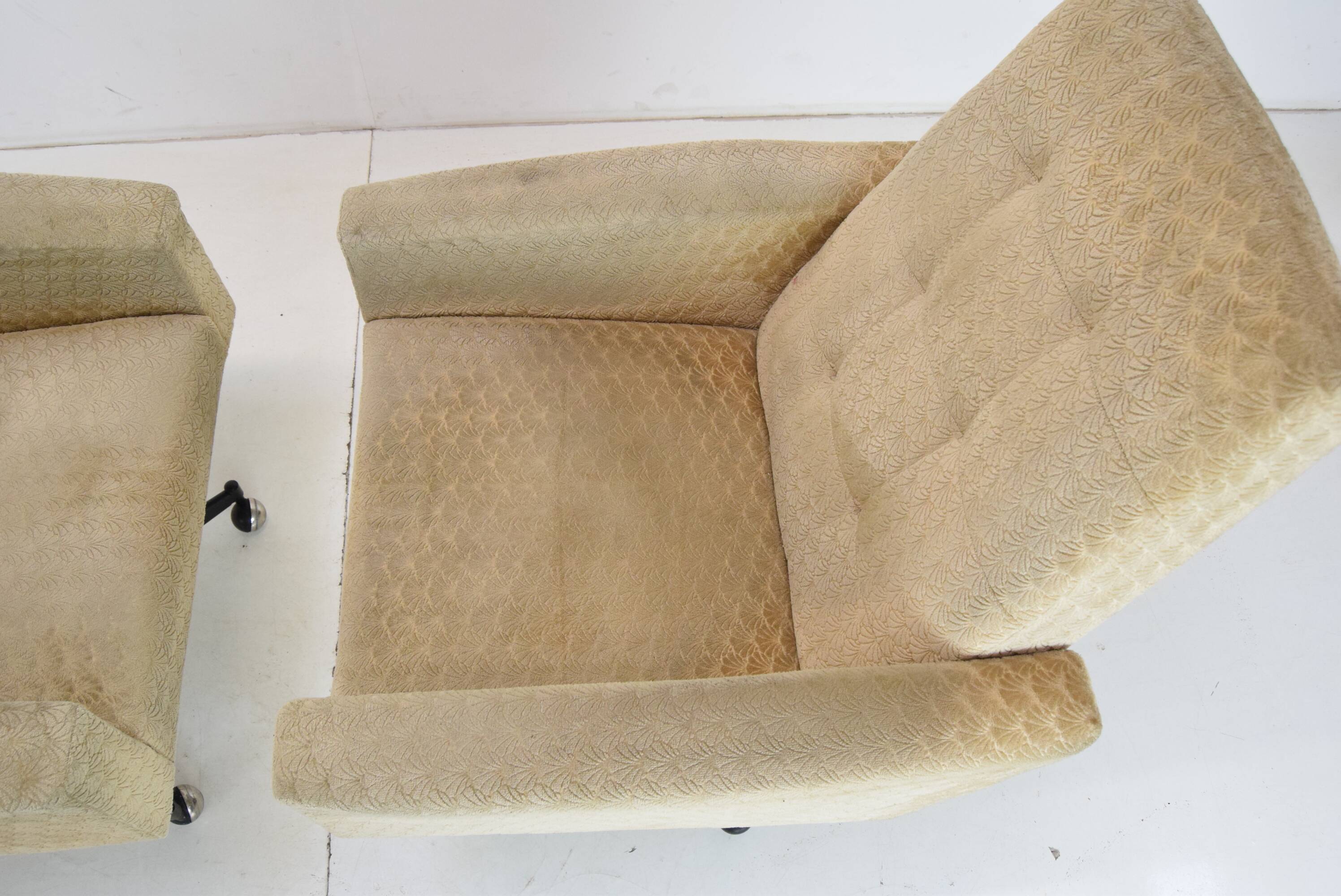 Pair of mid-century swivel armchairs with wheels 1970's