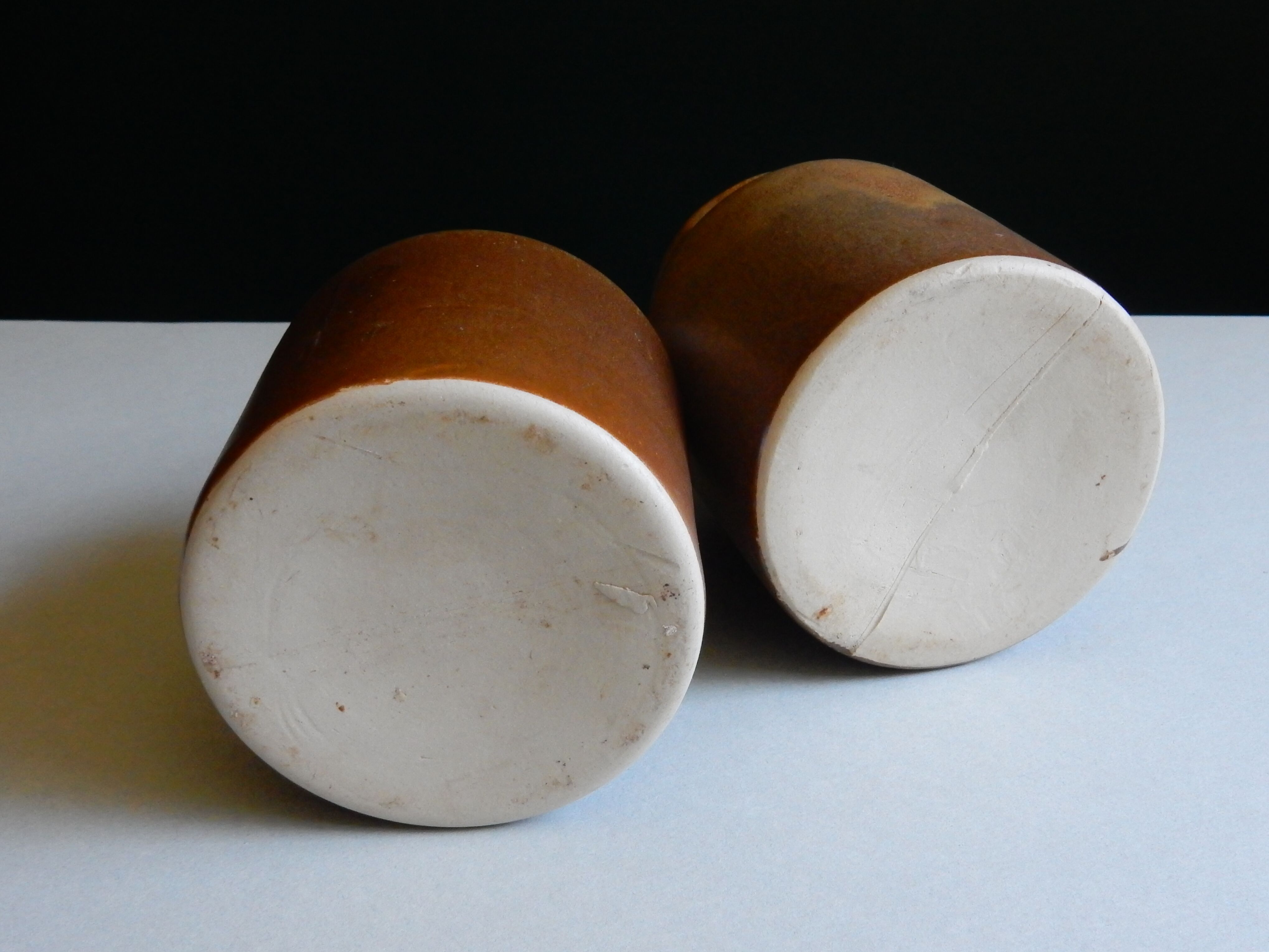 2 brown sandstone mustard pots