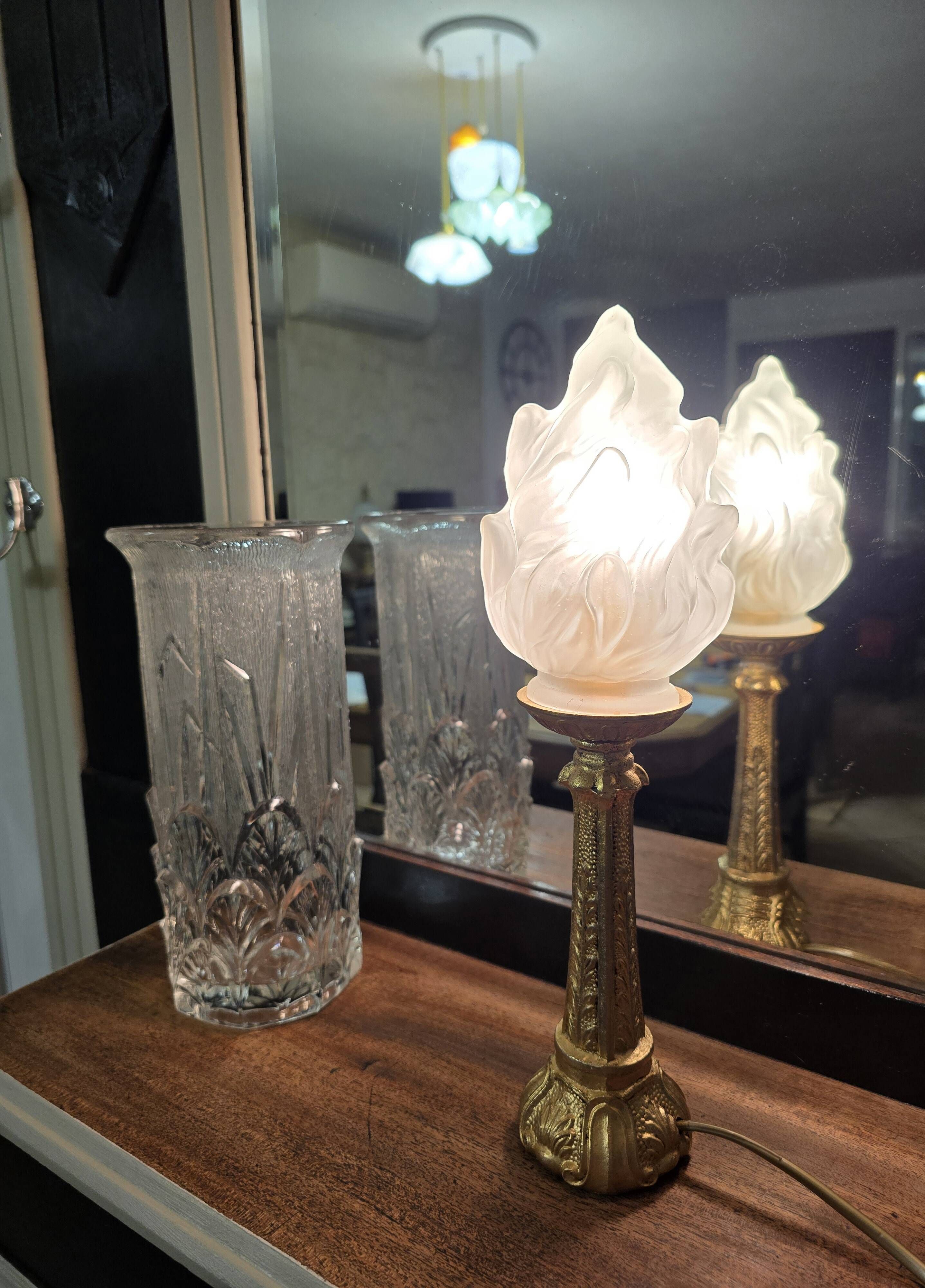 Table lamp with brass base and vintage flame globe