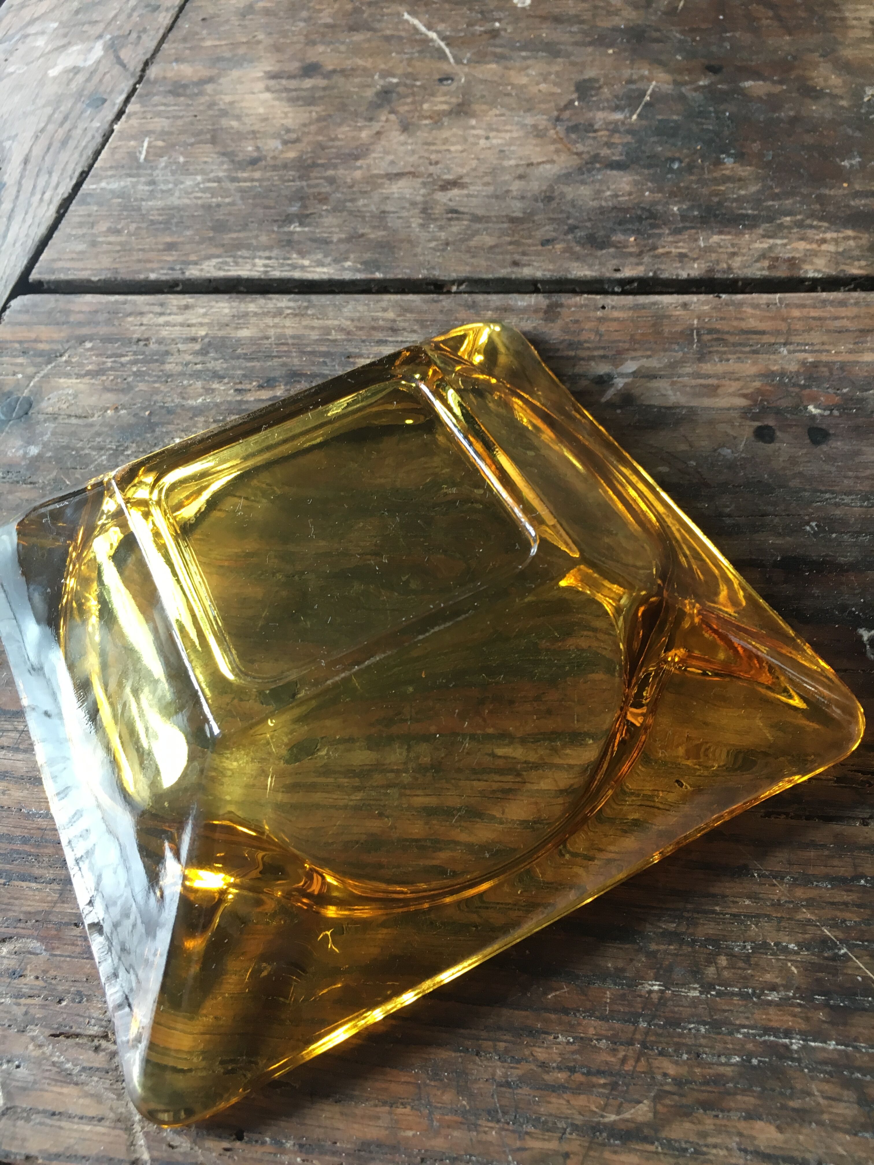 Vintage ashtray in amber glass