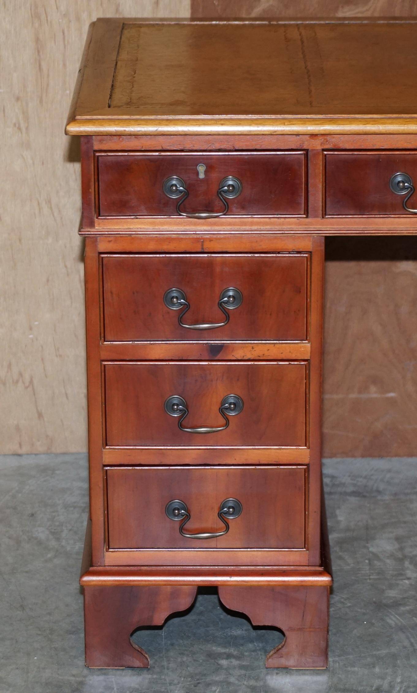 Vintage walnut desk with a leather top and two drawers.
