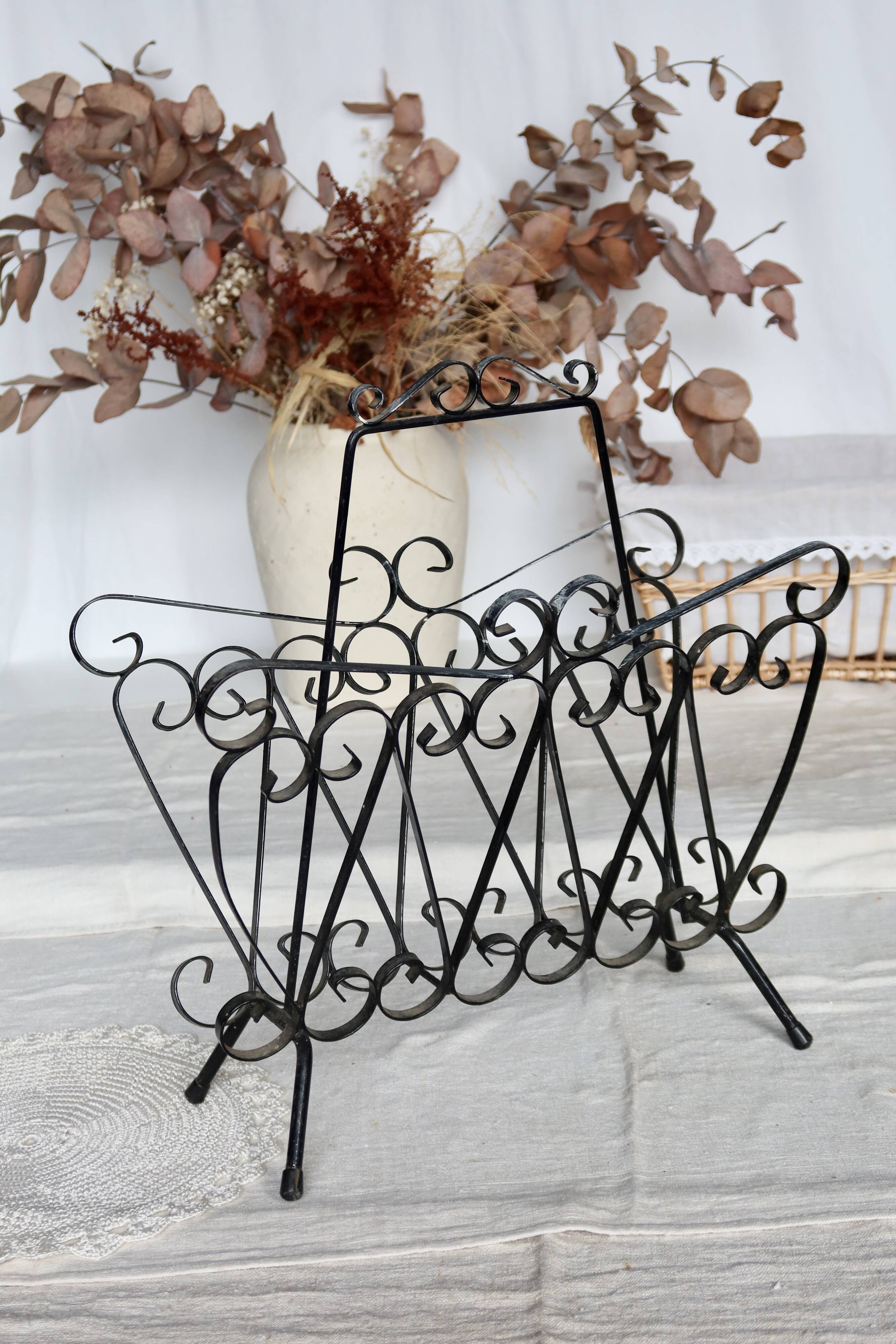 Vintage black metal scroll magazine rack