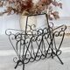 Vintage black metal scroll magazine rack