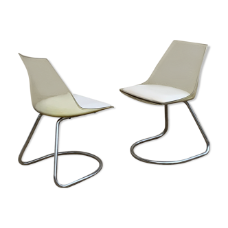 Pair of smoked plexiglas and 70's chrome chairs