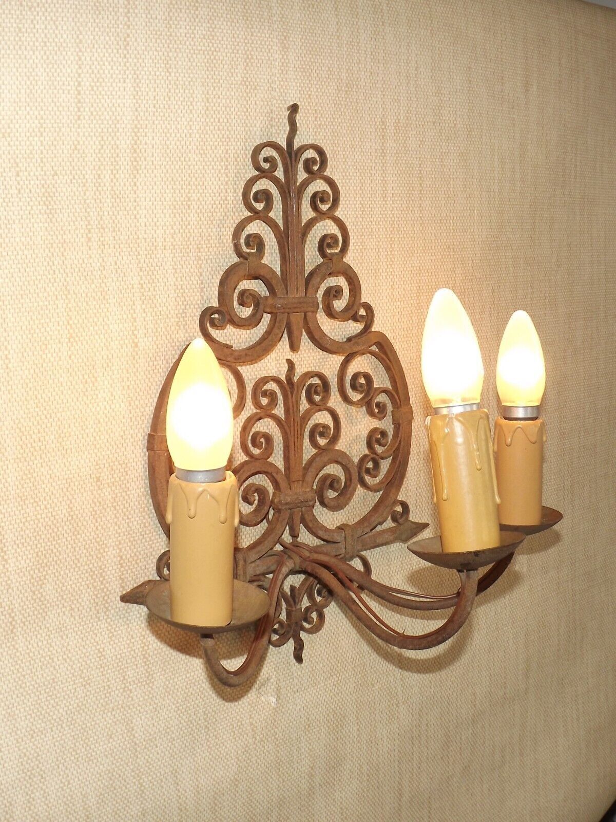French triple wall sconce in wrought iron, early 20th century.