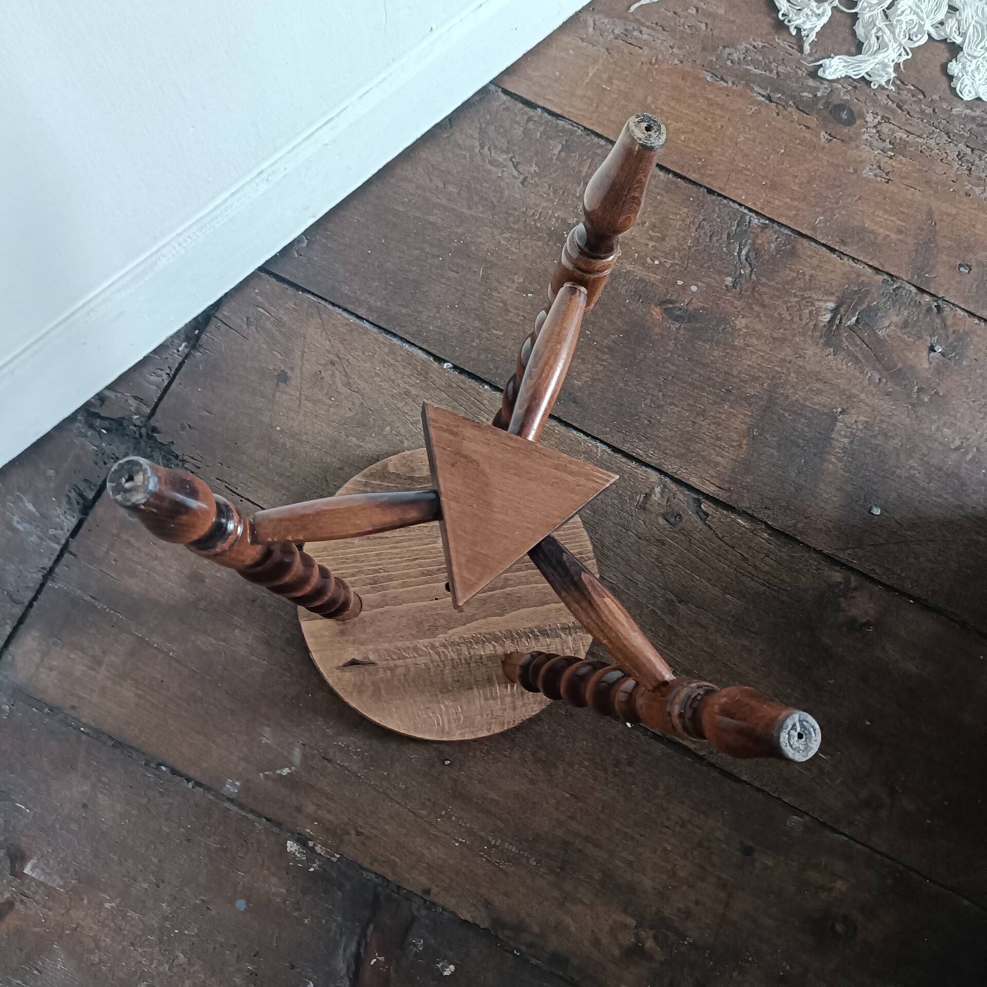 Tripod stool with turned legs