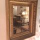 Miroir époque Restauration en bois doré à la feuille
