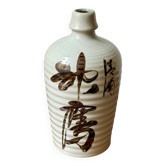 Old Japanese sake bottle in tokkuri shape.