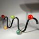 Coat rack in black lacquered metal and colored wooden balls