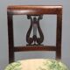 Pair of antique Directoire chairs in walnut and fabric, Italy, 19th century.