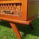Rattan and wood splayed-leg chest of drawers