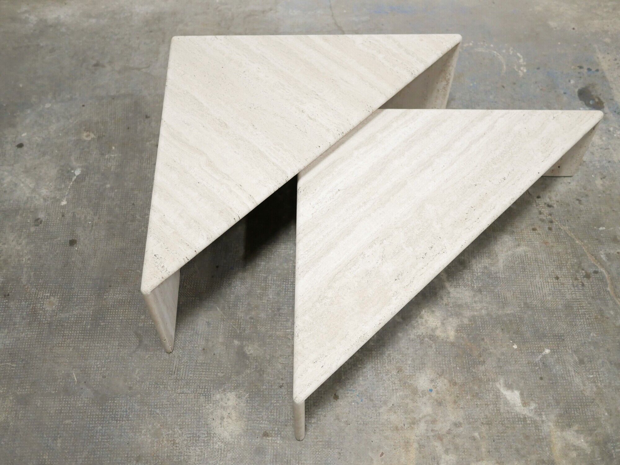 Series of 2 vintage travertine coffee tables published by Roche Bobois