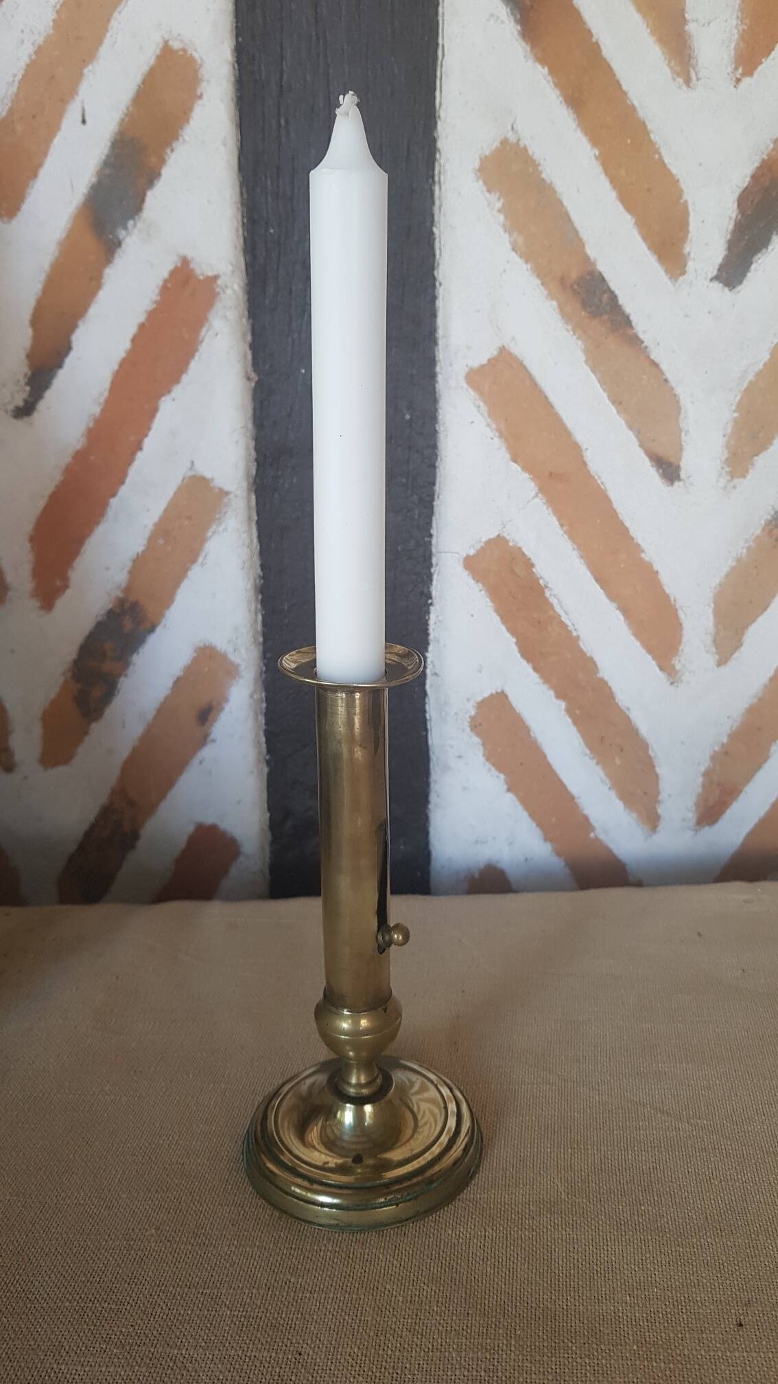 Brass candle holder with pusher and cup