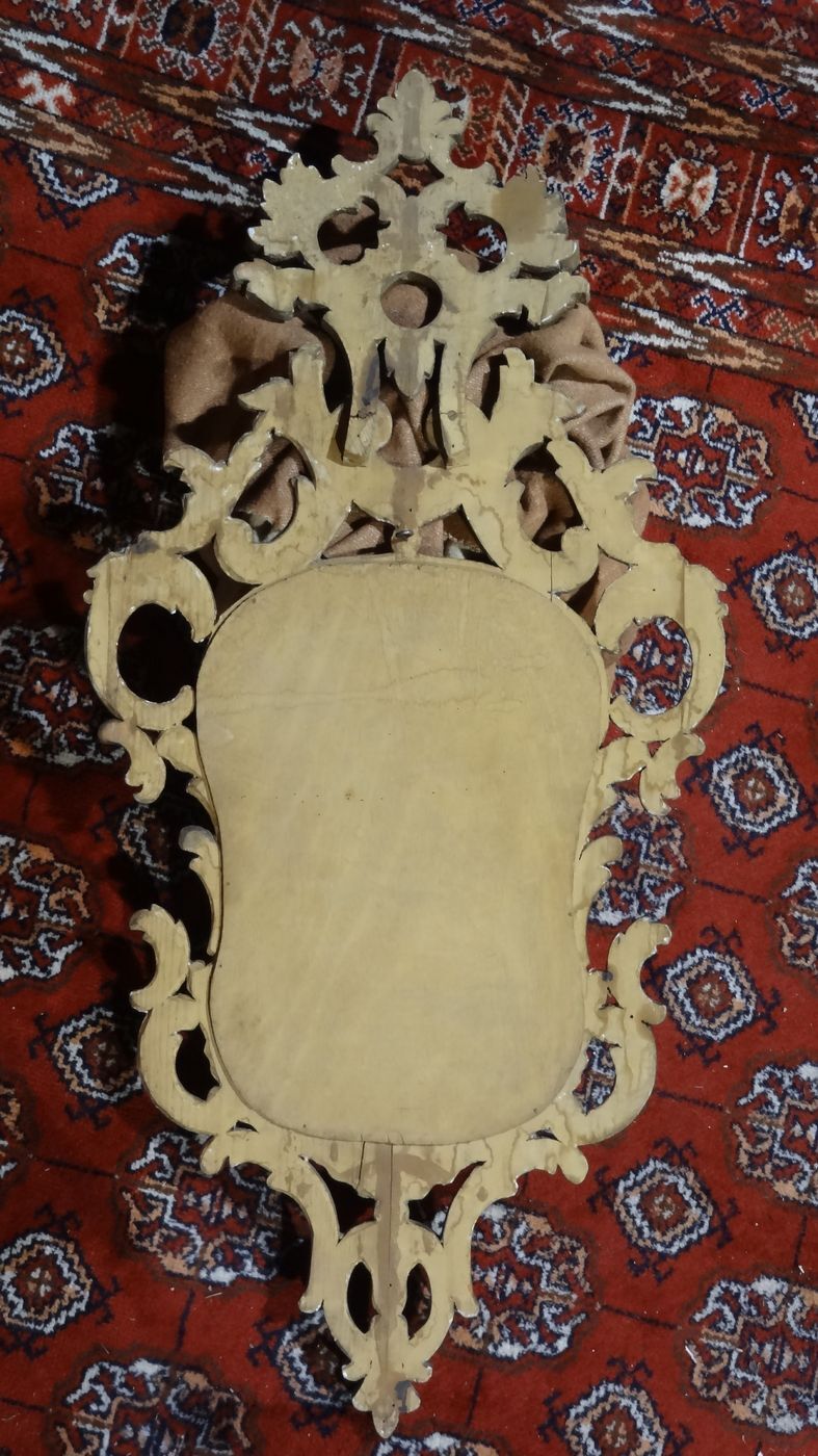 Carved and gilded wooden mirror with gold leaf 46 x 103 cm